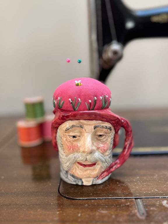 Pin cushion in repurposed vintage Toby jug embroidered flowers and bee