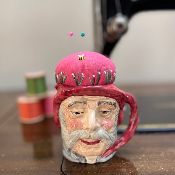Pin cushion in repurposed vintage Toby jug embroidered flowers and bee