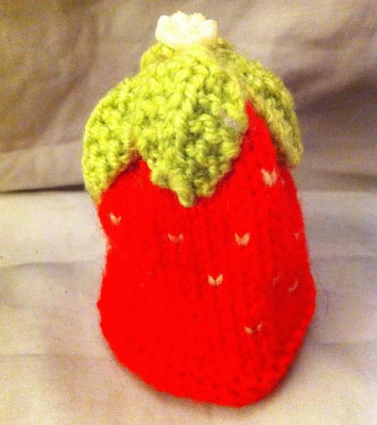 Little knitted strawberry egg cup cosy