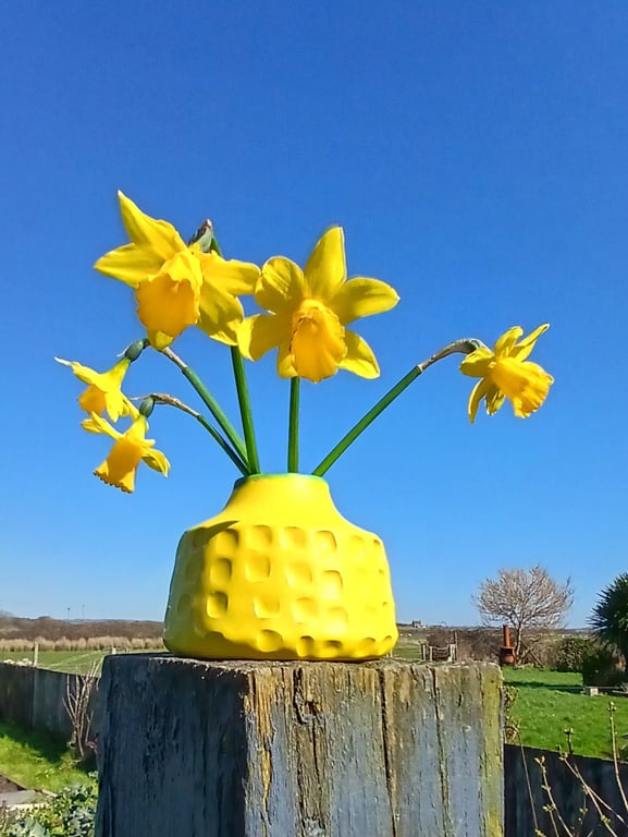 Small bright yellow bud vase 