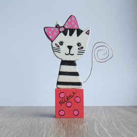 Cat ornament, wooden, black & white striped cat.