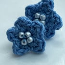 Handmade crochet cornflower blue flower stud earrings. 