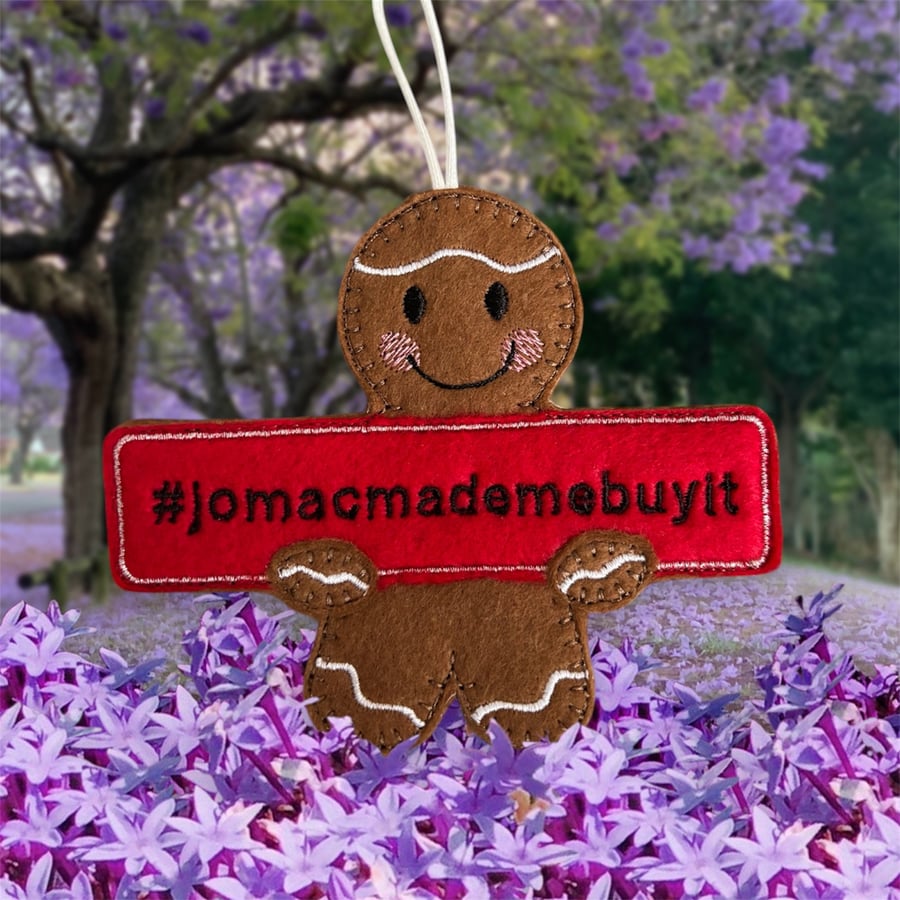 Gingerbread man holding a jomacmademebuyit sign Embroidered Hanging Keepsake