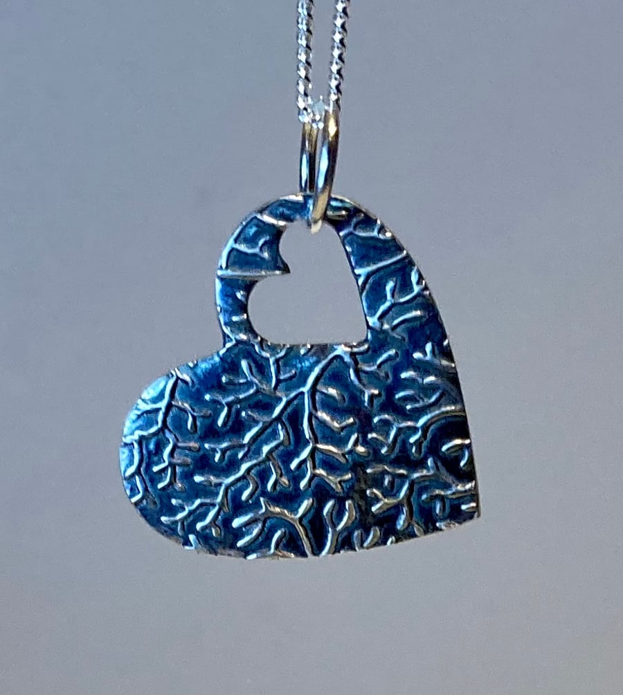 Silver heart with cut out heart detail and lovely texture 