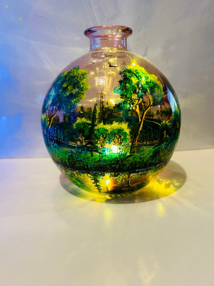 A hand painted and fired glass globe vase by Andrew Jenkins 