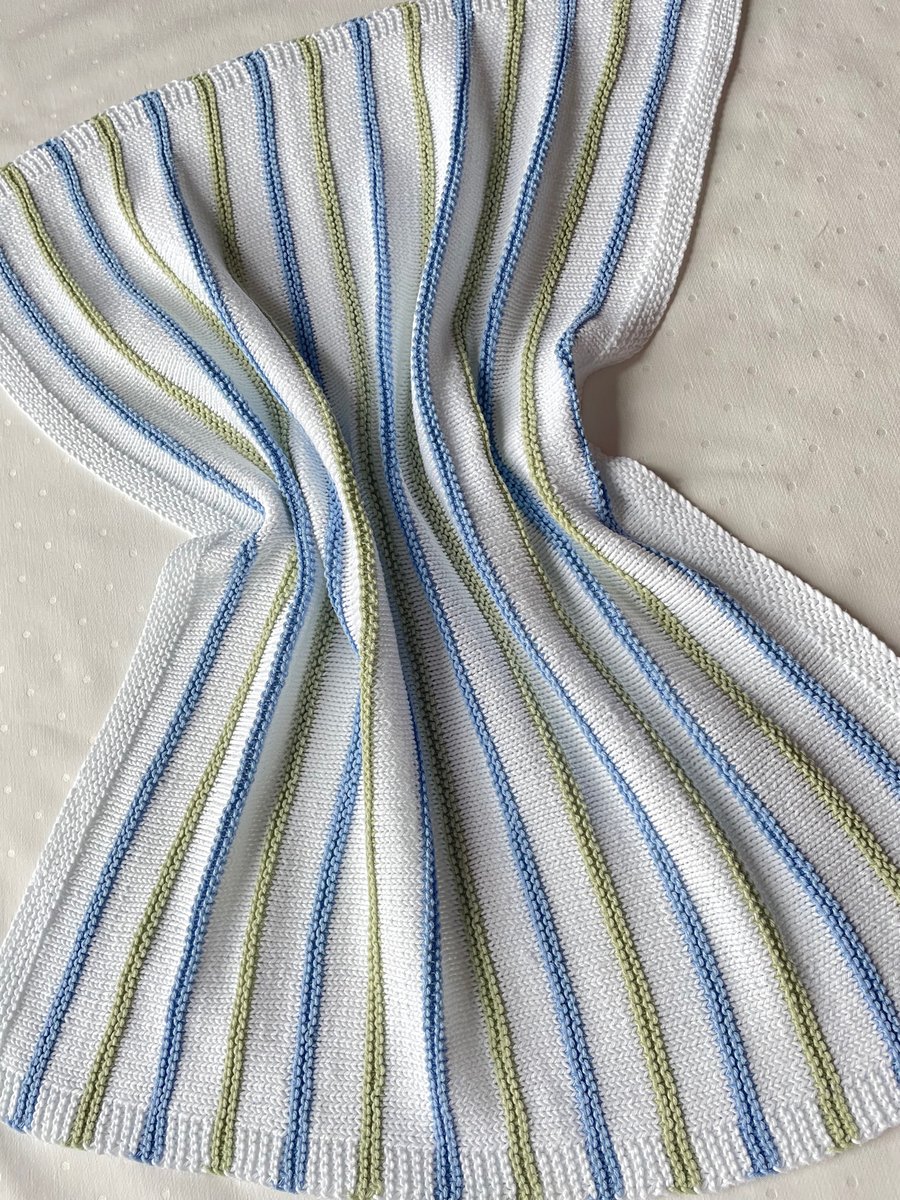 White baby blanket with pale green and blue stripes in 100% cotton yarn