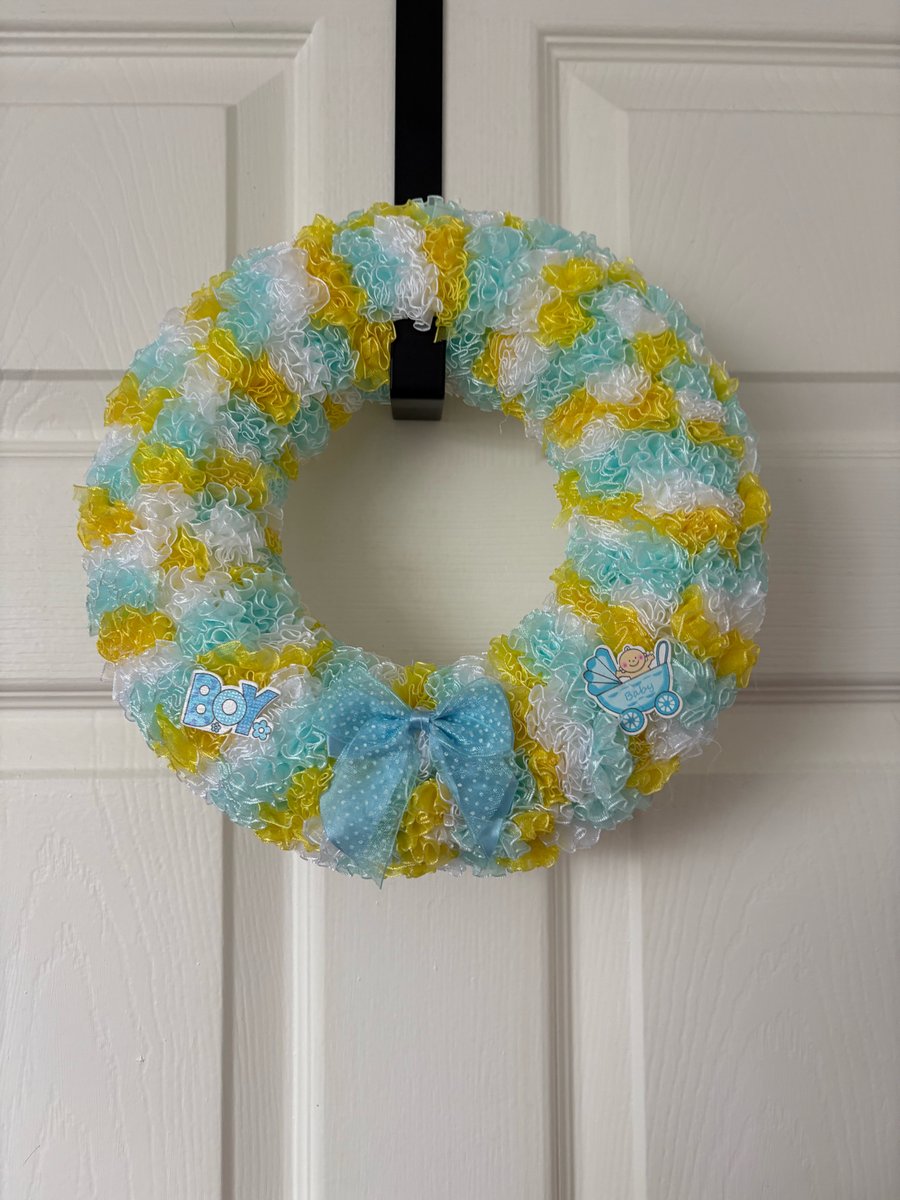 Baby boy shower decorated chiffon Pom Pom wreath. 