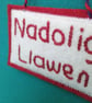Nadolig Llawen Christmas decoration hand embroidered felt in red and white  - Image 2