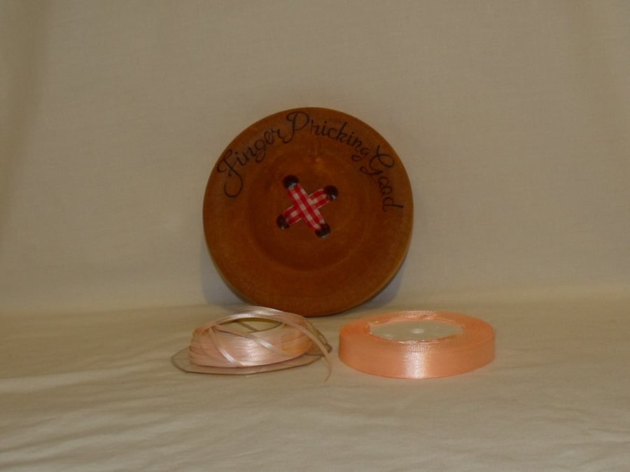 two rolls of 15mm  and 4mm satin ribbon, 25 metres on each, pink and peach trim
