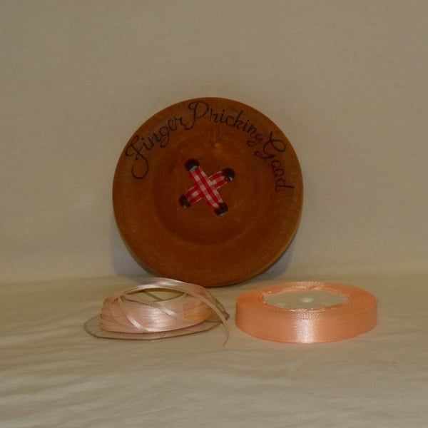 two rolls of 15mm  and 4mm satin ribbon, 25 metres on each, pink and peach trim