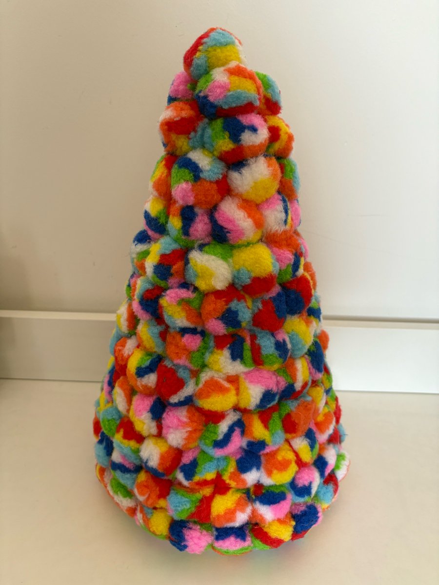 Large pride Pom Pom decorated cone. 