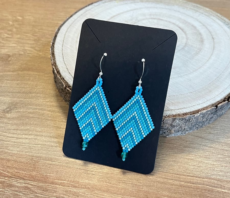 Beadwork chevron earrings in a mix of blue tones with a Czech glass drop
