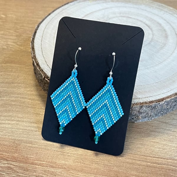 Beadwork chevron earrings in a mix of blue tones with a Czech glass drop