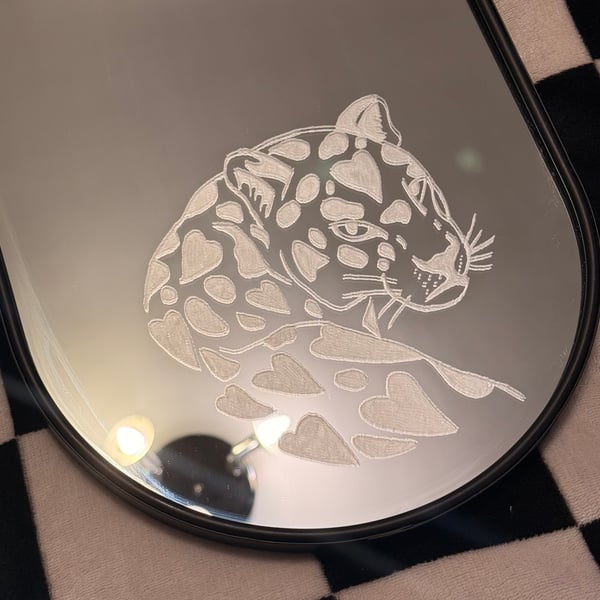 Engraved mirror