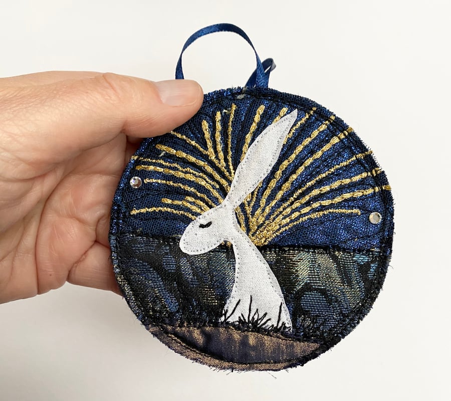 Upcycled embroidered winter hare home decoration. 