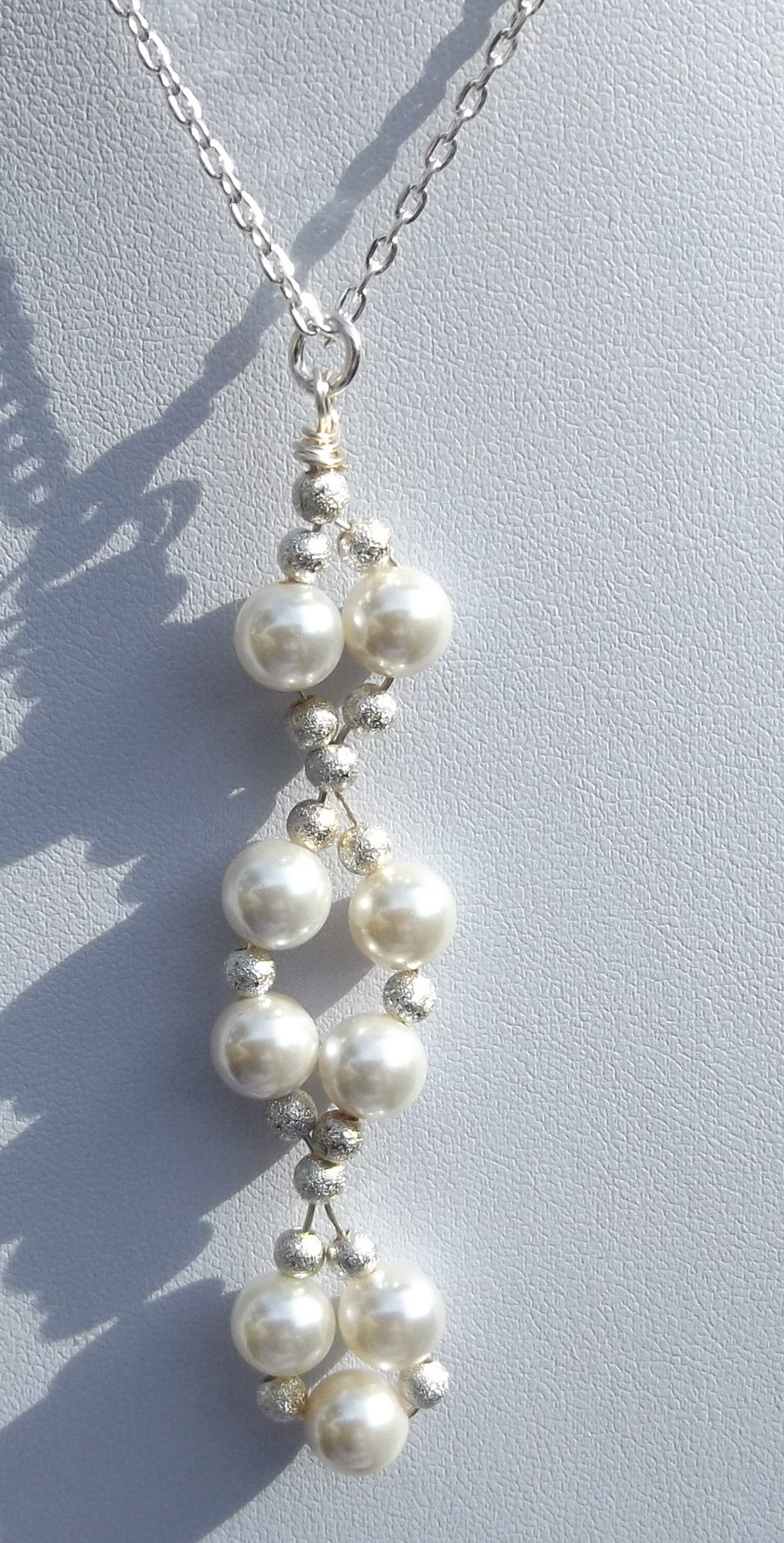 16" white shell pearl necklace with stardust silver spacers