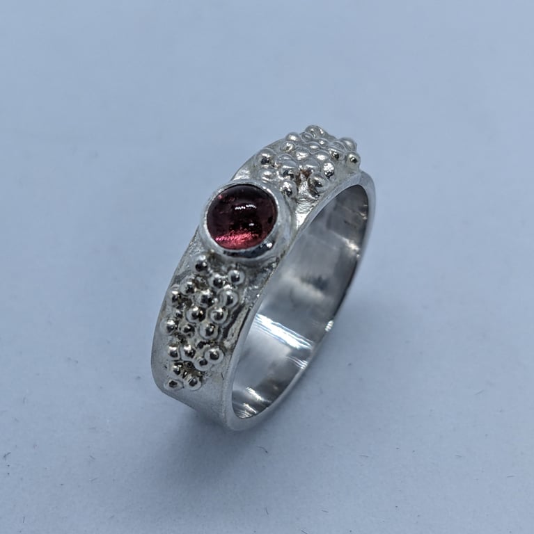 Sterling silver band ring with granulation and pink tourmaline 