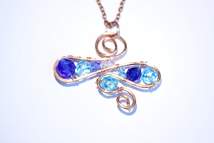 Blue glass bead and crystal swirling OOAK pendant wrapped in copper wire 
