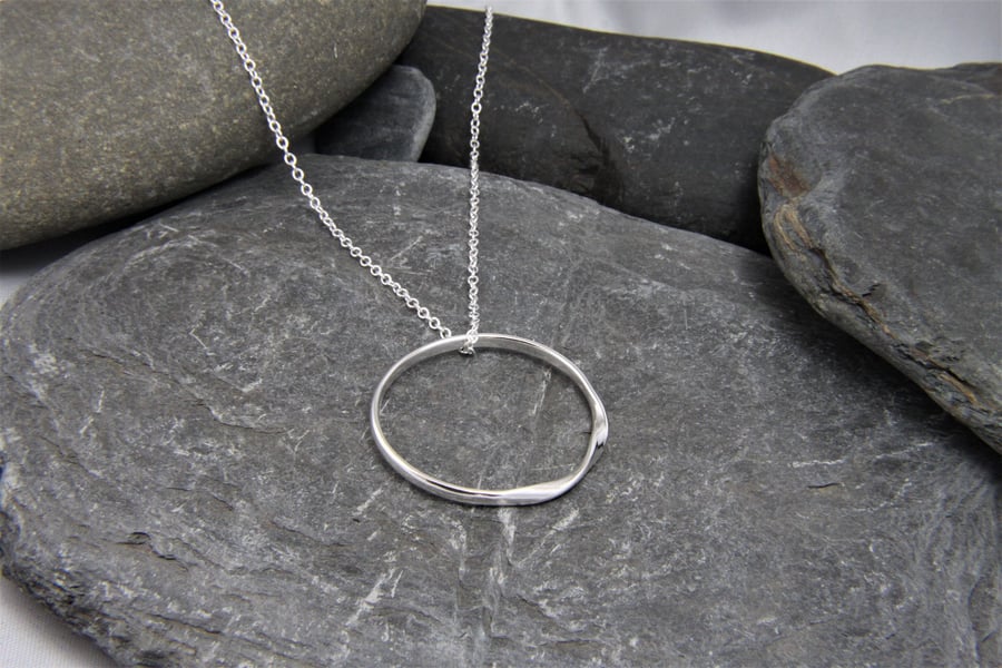 Rolling Waves Sterling Silver twisted hoop pendant necklace