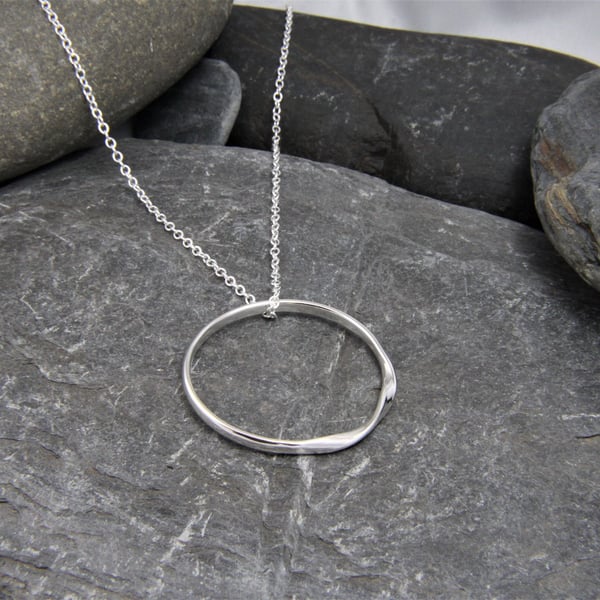 Rolling Waves Sterling Silver twisted hoop pendant necklace