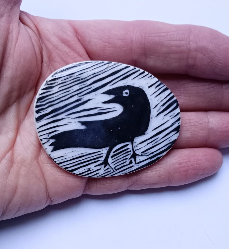 Crow brooch in porcelain