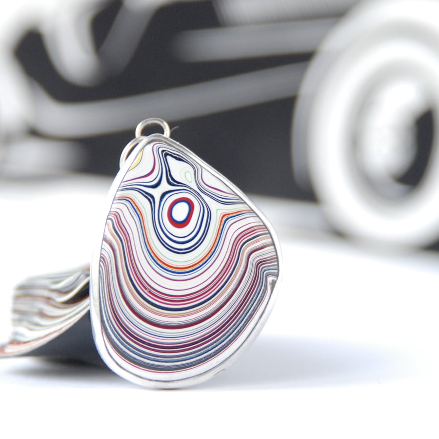 Kenworth fordite pendant (small red eye)