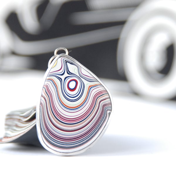 Kenworth fordite pendant (small red eye)