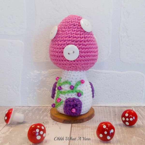 Crochet pink toadstool fairy house decoration, ornament or pin cushion.