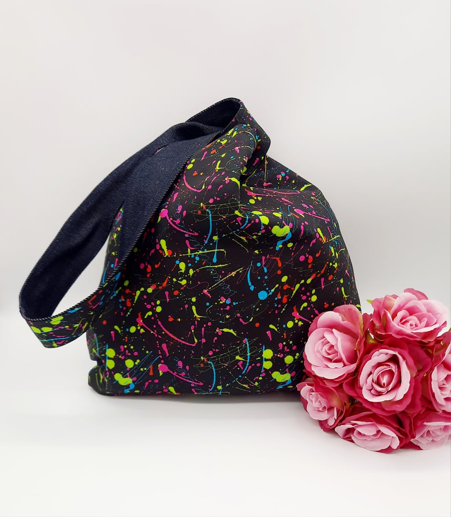 Denim reversible knot bag with black and neon splash cotton. 