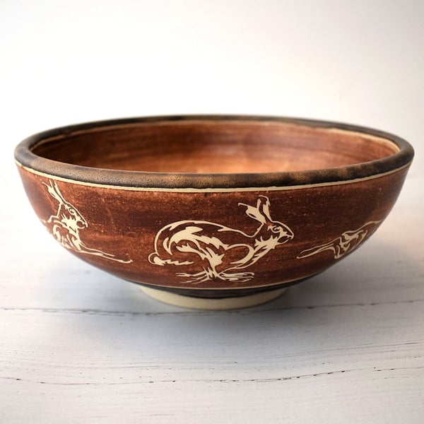 A332 - Ceramic bowl with running hares design  (Free UK postage)