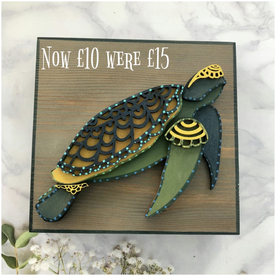 Layered wood turtle on freestanding wood block 