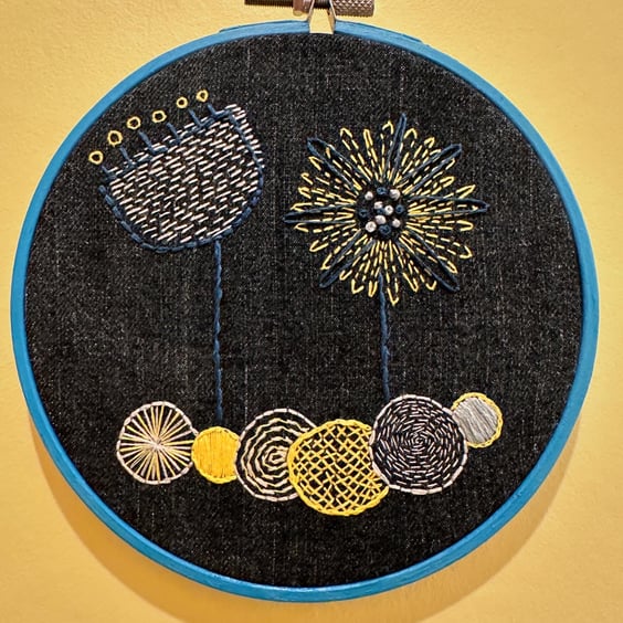 Embroidery Denim wall hanging with abstract flowers in blue hoop frame. Recycled