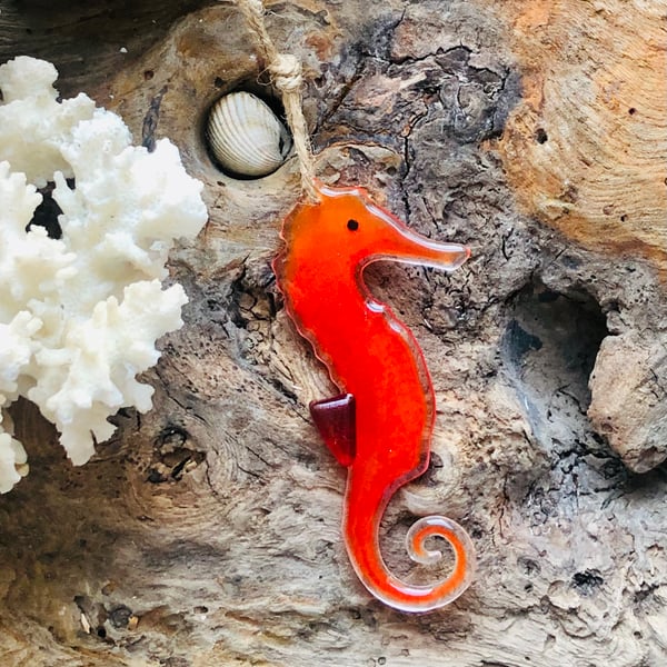 Red seahorse decoration made of fused glass hanging sun catcher from driftwood 