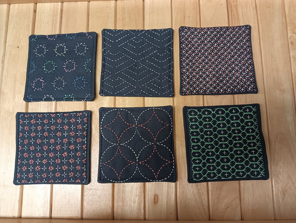 Set of six navy fabric coasters with sashiko embroidery detail 