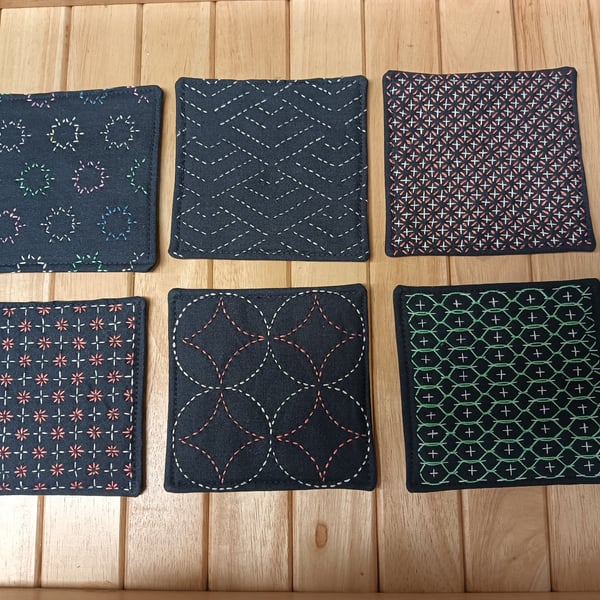 Set of six navy fabric coasters with sashiko embroidery detail 