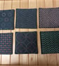 Set of six navy fabric coasters with sashiko embroidery detail 
