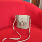 Hand-crocheted cross body Bag in Cappuccino with silver accessories