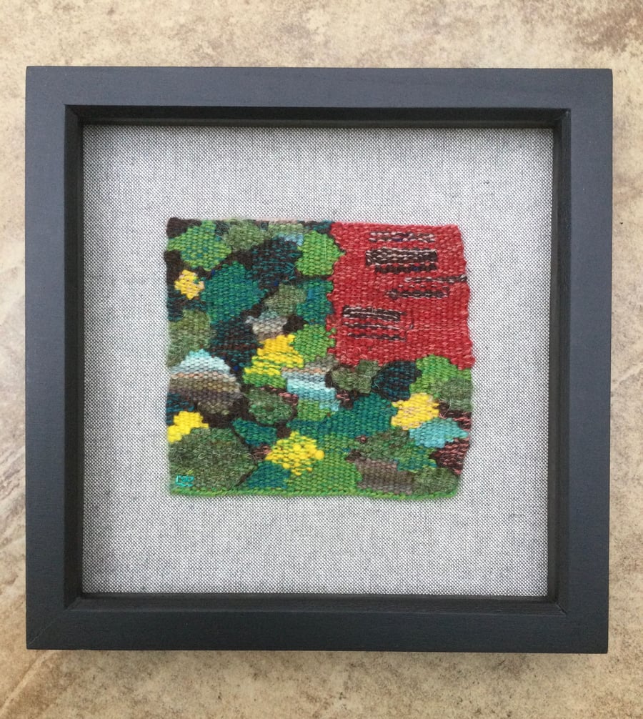 Framed handwoven tapestry weaving, textile art in green, yellow and red
