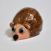 HAPPY HEDGEHOG CERAMIC ORNAMENT