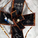 Handmade mini sewing box that unfolds to reveal everything for sewing tasks.