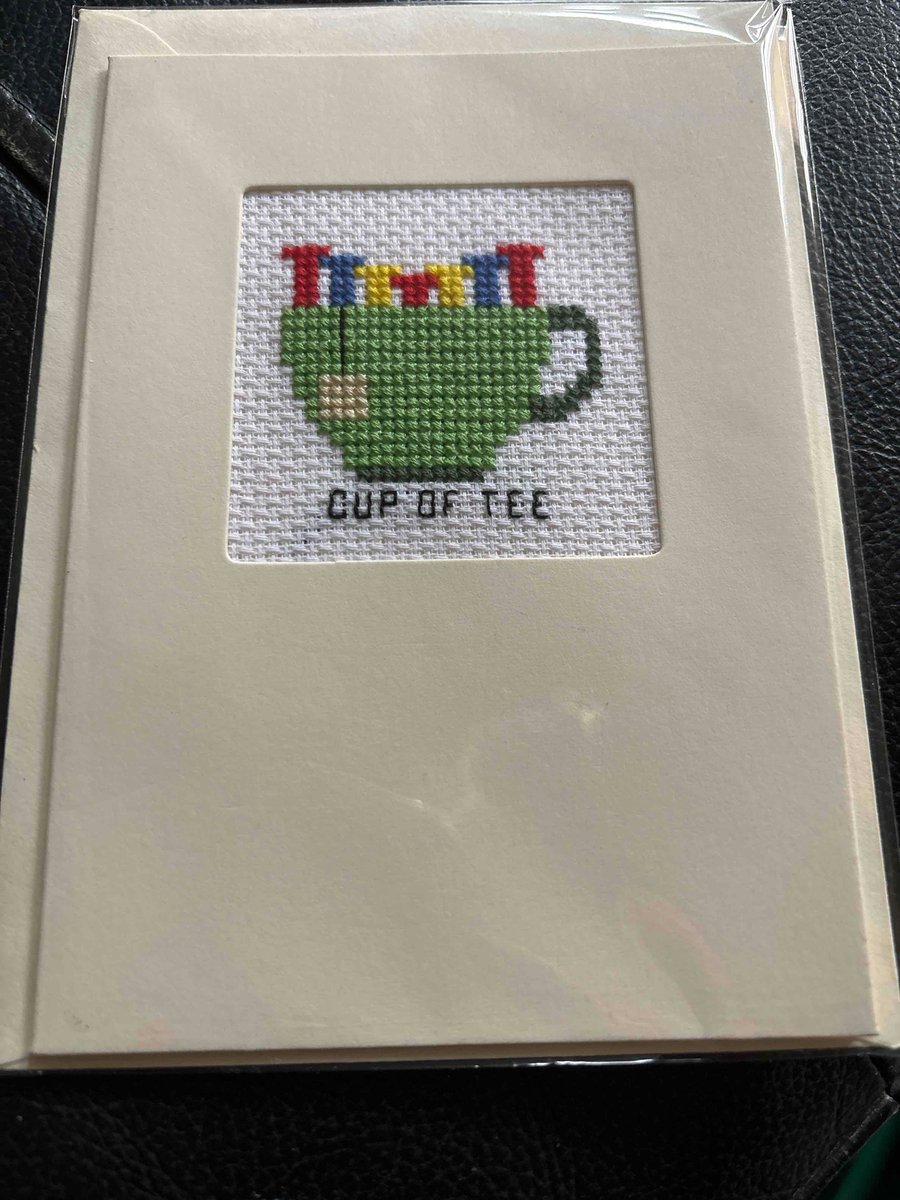 Cross stitched card . Cup of tee 