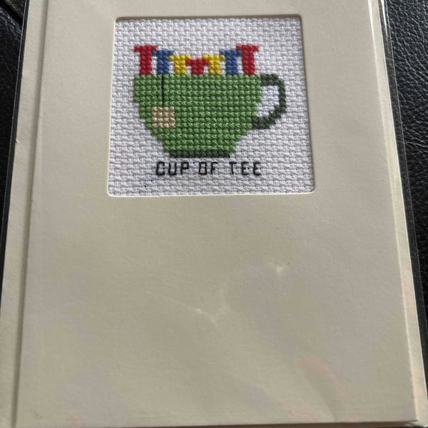 Cross stitched card . Cup of tee 