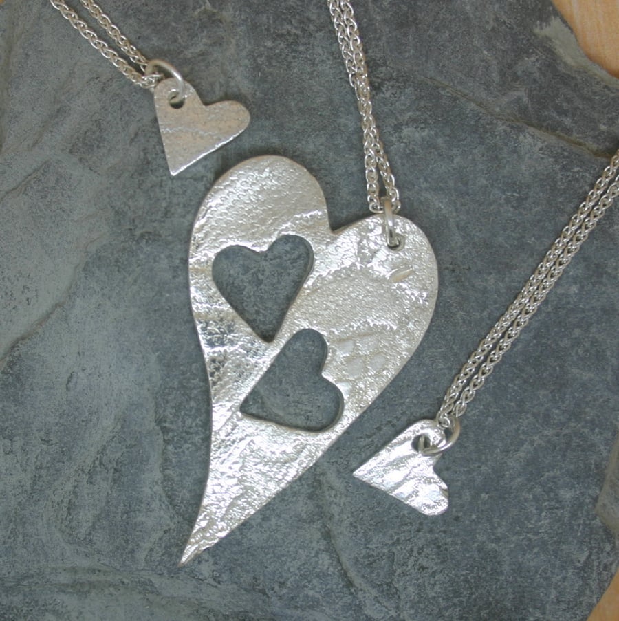 Mummy and Me. Three fine silver patterned heart pendants
