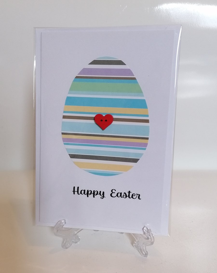 Happy Easter - blue striped Easter egg with a heart button greetings card 