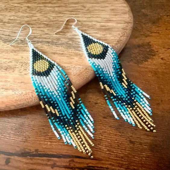 Handmade beaded feather-inspired fringe earrings in turquoise, gold & black
