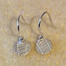 Circular pure silver earrings with leaf imprints 