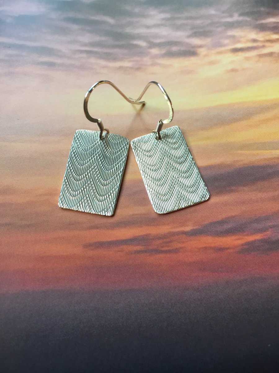 Silver swag earrings made from a cigarette case