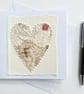Up-cycled handmade fabric embroidered heart art card. 