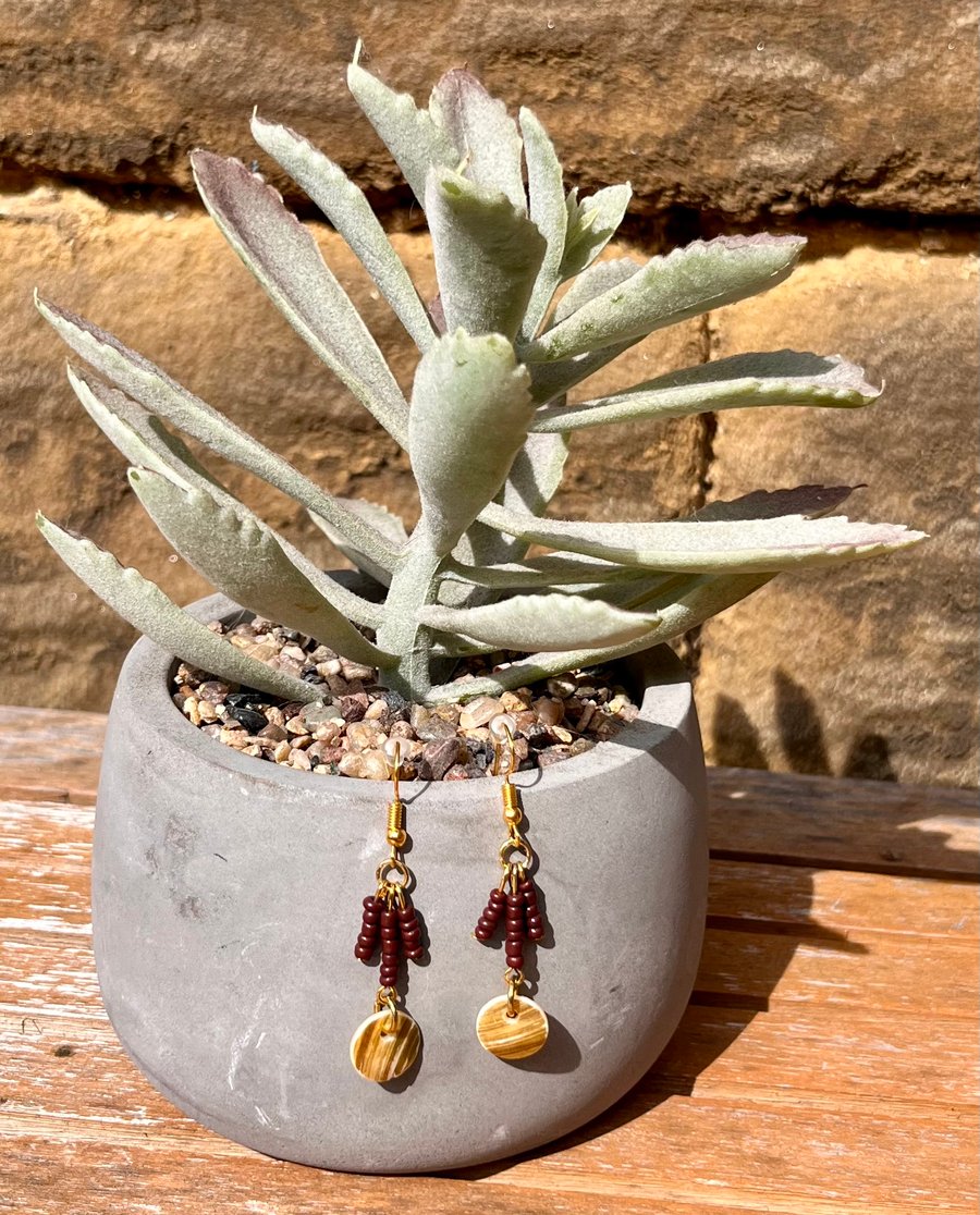 Pearlised shell and brown beaded dangle earrings