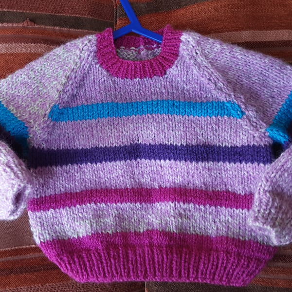 Pretty pink striped hand knitted baby jumper